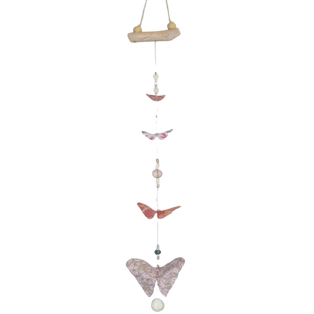 Decorative hanging mobile with butterfly shapes on a plain background
